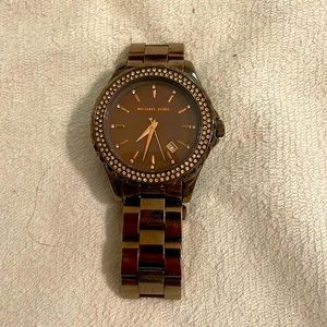 Michaels Kors woman’s watch, metallic brown